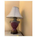 Vintage 30 inch porcelain lamp with brass and a wood base.