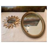 Vintage 14“ x 20“ gold oval mirror and a 11 inch gold sun shaped mirror