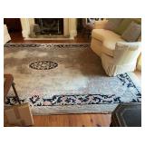 8.4‘ x 12‘ Savonnerie style, hand woven hundred percent wool pile rug with a cotton foundation.  This rug has a gray background with a charcoal border with a medallion and floral design. This rug 