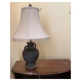 Antique Asian inspired bronze lamp on wood base 21 inches tall