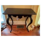 Black with red distressed table. 34” x 17 1/2” x 30 1/2”