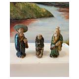 Three Chinese Mudman clay figurines. Handmade pottery sculptures. Approximately 4” one missing his hat.