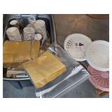 Container of gold color napkins and cups. Great addition for the upcoming fall and Christmas season. Many are unopened. Also includes plastic paper plate holders and wood rack.