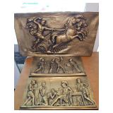 Mid century Neo-Classical relief wall plaques features a dynamic mythological scene of a figure driving a four-horse chariot (quadriga), mythological scene from [Homer