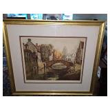 Research indicates this is an etching titled "The Stone Bridge" is by the listed Belgian artist Lucien Dasselborne (1873–1952), capturing a serene canal and old stone bridge in Flanders. Unable to f