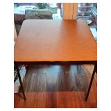 Square folding card table. 33.5 x 33.5 x 28 in tall.