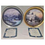Two Thomas Kinkade collector plates. "Olympic Mountain Evening" by the Bradford Exchange 2002 and "Victorian Christmas" by The Bradford Exchange 2000. Both with certificates of authenticity and in ori