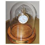 Hummel "Ring Around The Rosie" pocket watch with gold color case in glass dome display case. Needs new battery.
