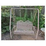 Metal swing on metal frame. Frame is 52.5 wide x 38 in deep x 61 in tall. Swing is 42.5 in wide x 28 in deep x 33.5 in tall. Seat height is 18.5 in tall.