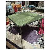 Green vinyl top folding card table. 30x30x 206.5 in tall.