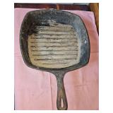 Lodge Square cast iron grill skillet. 10 in square x 2 in tall. Needs cleaned and reasoned
