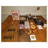 Miscellaneous grouping with 50-year anniversary cake topper, silver plate flatware, brass flatware, trivets and more. See all photos.