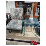 Iron patio rocking chair with cushions. 24x20x34 in tall. Seat height is 17.5 in tall. Also includes a metal scroll work glass top table 18x18x23 in tall. Lamp not included.