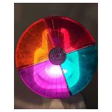 Vintage tree illumination light with 4 revolving colors. Works. Housing is plastic and requires tape or a twist tie on two edges. Would also suggest an LED bulb to reduce heat on the plastic housing a