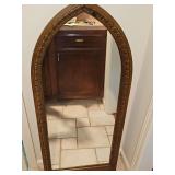 Stanley Furniture Gothic cathedral-style arched wall mirror features an ornate carved wooden frame with classic pointed arch architecture, reminiscent of mid-20th-century statement pieces. 21.5 x 47.5