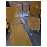 Two adjustable mesh lounge chairs and two sand chairs.