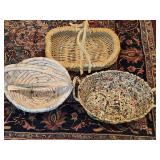 Two unique baskets. One made with fabric, one made with newsprint and/or magazines also includes a woven basket with natural branch handles.