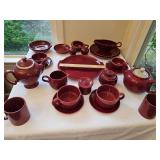Burgundy stoneware pieces. Maker