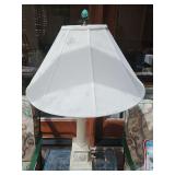 Column lamp with canvas shade. 32 in tall to top of finial. Did not see any stains on lamp shade. Darker colors are from Sun coming in through glass roof.
