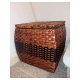 Lidded wicker storage box and contents of vintage dolls