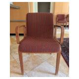 Vintage Bill Stephens 1300 Series armchair featuring a warm wooden frame and red-and-black striped upholstery - scuffing along bottom of legs from normal use