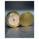 NIB - vintage Tiffany & Co. Brass Swivel Travel Alarm Clock featuring a compact, round brass case with a protective swivel lid