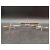 Grouping of (3) Tiffany & Co. ballpoint pens - the 2 “Diamond Purse Pens” on each end have sterling casing - red pen is in original box - other 2 are loose in different box