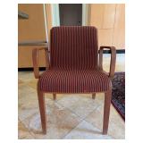 Vintage Bill Stephens 1300 Series armchair featuring a warm wooden frame and red-and-black striped upholstery - scuffing along bottom of legs from normal use