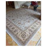 Traditional Indian hand-knotted wool area rug with an intricate all-over Persian-style floral and vine pattern in soft beige, ivory, and muted earth tones - 12 x 15