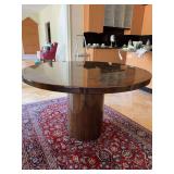Stunning round high-gloss lacquered burl wood dining table featuring a central cylindrical pedestal base - 48”D x 30” tall