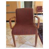 Vintage Bill Stephens 1300 Series armchair featuring a warm wooden frame and red-and-black striped upholstery - scuffing along bottom of legs from normal use