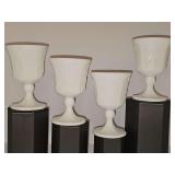 Four Indiana Glass Colony Harvest milk glass goblets with an embossed grape and vine pattern. 5.25 in tall.