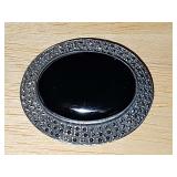 Sterling brooch with oval black stone. 2 x 1 5/8 in