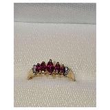 14k yellow gold ring with red and clear stones. Size  6 1/4 weighing 2.2 g