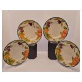 Four Franciscan Fresh Fruit earthenware salad or dessert plates, hand-painted with a cluster of colorful fruits and a green rim. 8 inch diameter.
