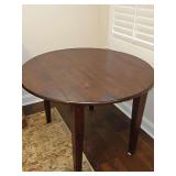 Beautiful all wood drop leaf table. Dimensions with both sides dropped - 41.75 x 26.25x 31 in tall. With sides raised dimensions are 41.74 x 42 x 31 in tall.