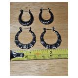 Two pair of sterling silver earrings weighing 9.6 g.
