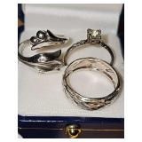 Three Sterling Silver rings. Two w/o stones are size 8 1/2, ring with solitaire clear stone is size 8. Weight for all three is 8.6 g.