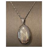 Sterling Silver locket on Sterling 30 inch chain weighing 14.7 g.