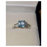 Sterling Silver ring with light blue and clear stones. Size 8 3/4