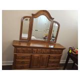 Rock City Furniture Company two-door - 9 drawer oak dresser with tri-fold mirror. Dreaase is 66 x 18.5 x 36 in tall. Mirror is 52 x 43 in tall. Side folds are 12 in wide.
