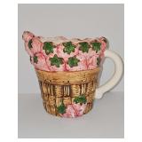 Strawberries in basket pouring pitcher. 7 in tall.