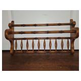 Bamboo look wall rack for holding towels? Appears to have a rod holder also. (Missing) 21.75 wide x 5.75 deep x 12.5 in tall.