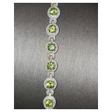 Sterling silver bracelet with green stones. 7 1/2 in.