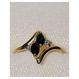 14 karat yellow gold ring with blue and clear stones. Size 5 1/2 weighing 1.4 g