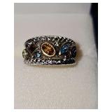 Sterling Silver ring with multi color clear stones. Size 6 3/4.