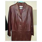 Preston & York single breasted hip length burgundy/brown leather jacket with two front pockets. Size 1X. In very good condition.