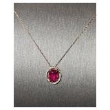 10K yellow gold ruby and diamond pendant on a 10K yellow gold 18 in chain.