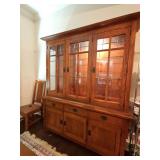 Kincaid Furniture Company Mission Arts and Crafts Style lighted china cabinet with two glass shelves, three drawers and three doors. This is a one piece cabinet. 69 x 18 x 83.25 in tall. One bulb need