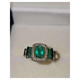 10K yellow gold ring with green and clear stones. Size 8 weighing 2.8 grams.